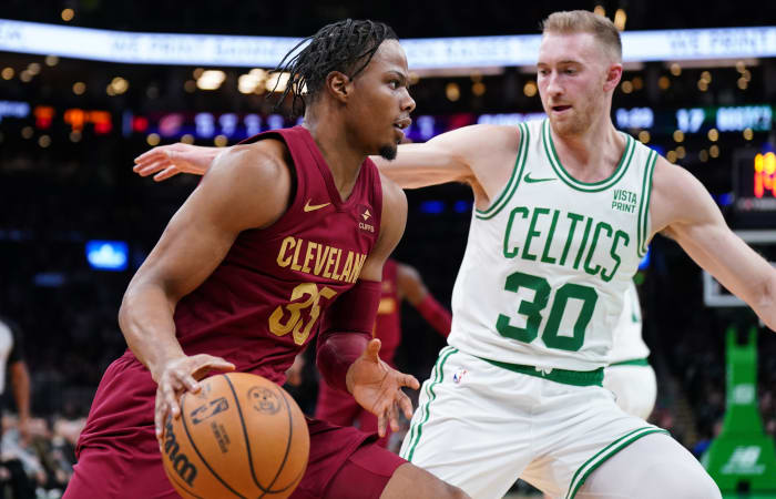 Dec 12, 2023; Boston, Massachusetts, USA; Cleveland Cavaliers forward Isaac Okoro (35) drives the ball against Boston Celtics forward Sam Hauser (30) in the first quarter at TD Garden. Mandatory Credit: David Butler II-USA TODAY Sports